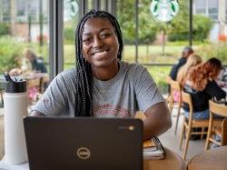 Student working online at coffee shop